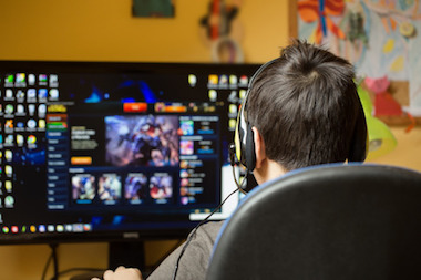 Photo of boy playing video game